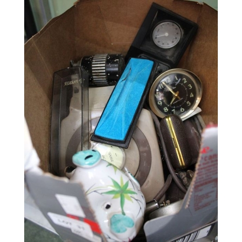 31 - A box of small domestic items such as clocks, pens and phones.