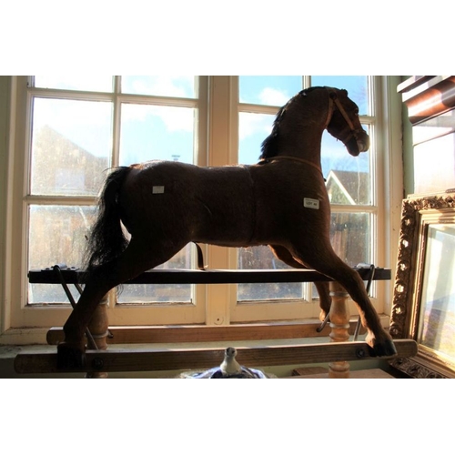 48 - A rocking horse on trestle frame