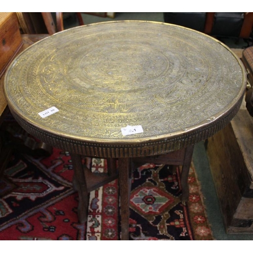 60 - A fold out brass top table.