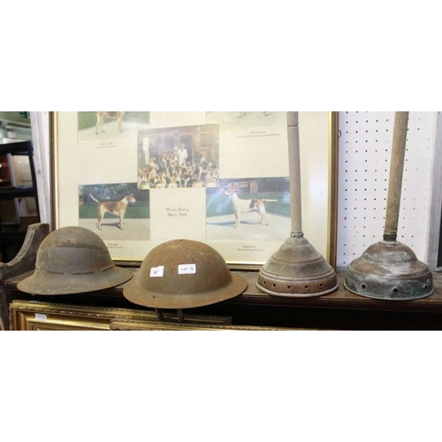 75 - Two military helmets possibly first world war, together with two copper dollies.
