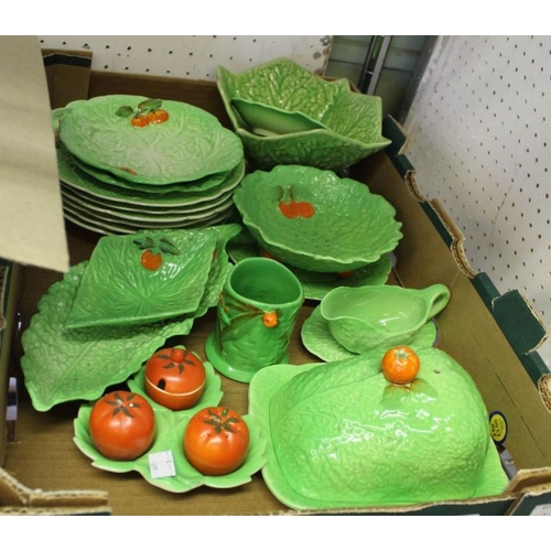 96 - A large collection of leaf moulded table ceramics to include, condiment set with individual tomato i... 