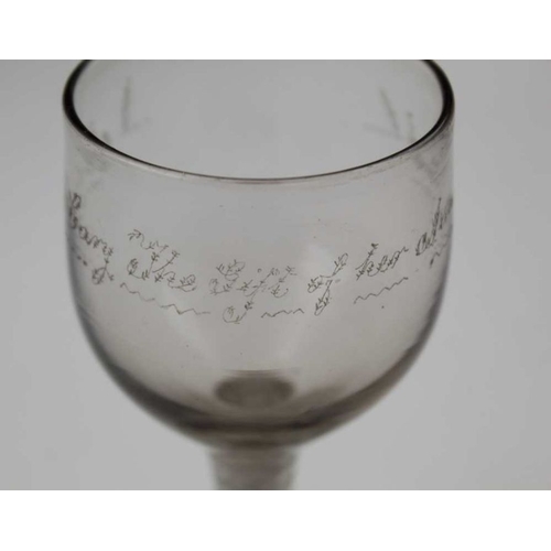 103 - An 18th century wine glass, cotton twist stem and conical foot, the bowl engraved 