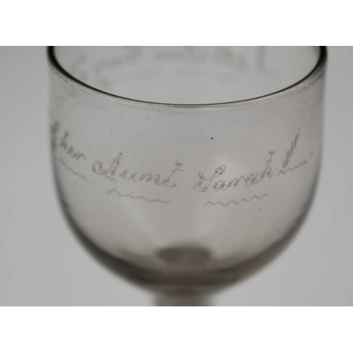 103 - An 18th century wine glass, cotton twist stem and conical foot, the bowl engraved 