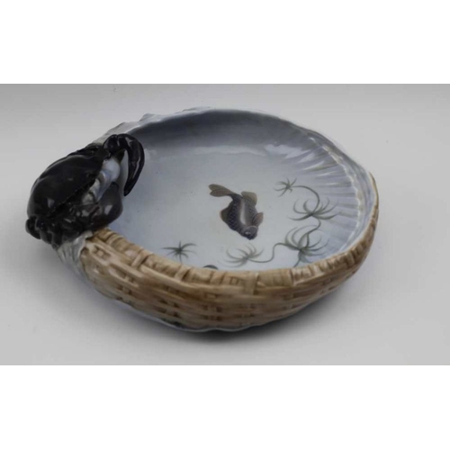 110 - A Royal Copenhagen bowl, modelled with a crab on the rim of a basket, painted with a fish to the bas... 