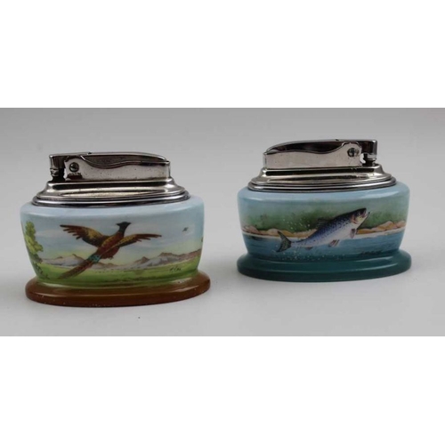 116 - Two Minton table lighters, one decorated with a pheasant in flight, signed T.Lee, the other a leapin... 