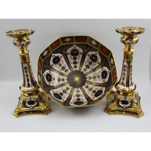 118 - A pair of Royal Crown Derby bone china candlesticks, decorated and gilded in the Imari palette No. 1... 