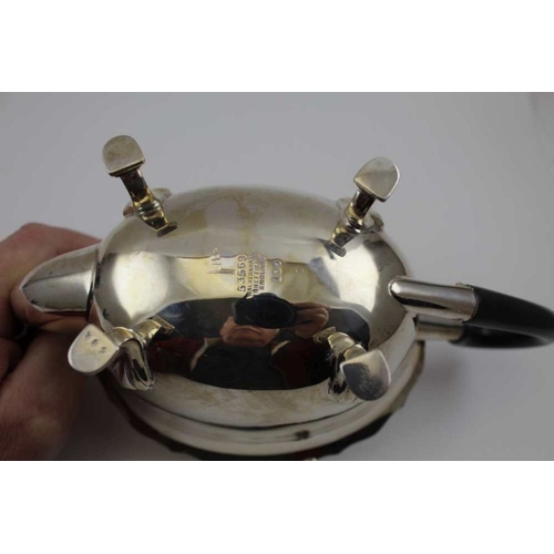 12 - Walker & Hall, A silver teapot, shaped rim, hinged cover, raised on four hoof feet, Sheffield 1914, ... 