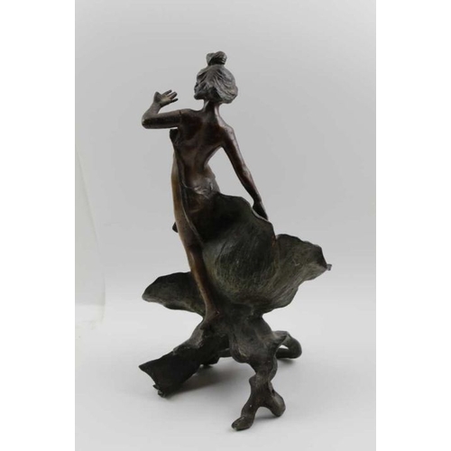 131 - A French spelter Art Nouveau figure, modelled as a girl beside a poppy, c.1900