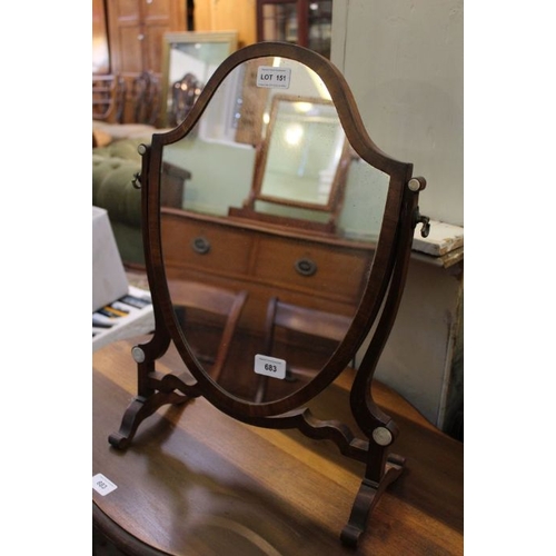 151 - A small shield shaped dressing table top mirror.