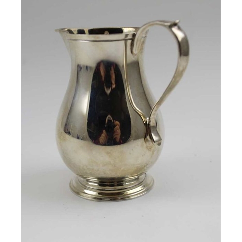 16 - A Georgian design silver cream jug, baluster form with sparrow beak rim, Birmingham 1966, 143g