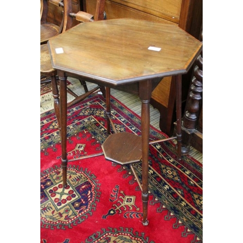 165 - An Edwardian octagonal topped table with satin wood cross banding supported on four lightly turned l... 