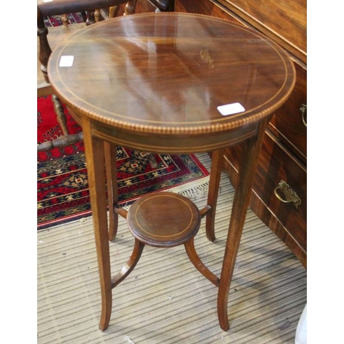 169 - An Edwardian mahogany circle topped table with decorative edging. On four plain out swept legs with ... 