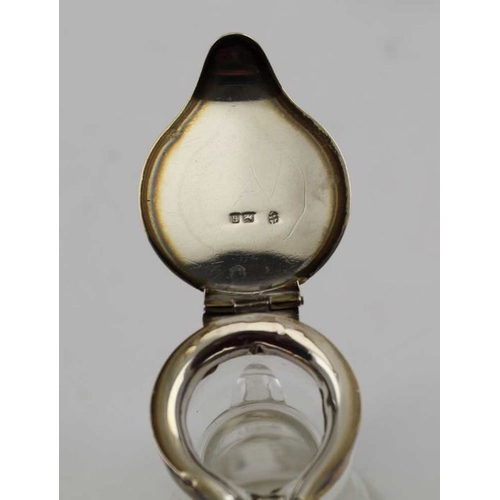 20 - J & J Maxfield Ltd. An Edwardian silver mounted glass whisky noggin, Birmingham 1907, with handle an... 