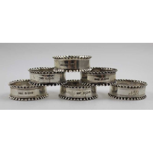 21 - A set of six late Victorian silver napkin rings, fluted edges, Birmingham 1900, combined weight: 89g