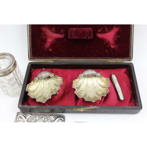 27 - Henry Williamson Ltd. An Edwardian silver card case, London 1909, a pair of cased silver scallop for... 