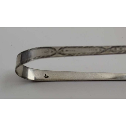 29 - Richard Sawyer, a George III pair of silver sugar tongs, Dublin 1817, a pair of late 18th century su... 