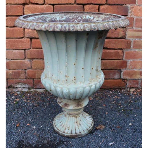 303 - A Regency design cast iron Campana form urn, with egg & dart rim over a fluted waisted body on outsw... 