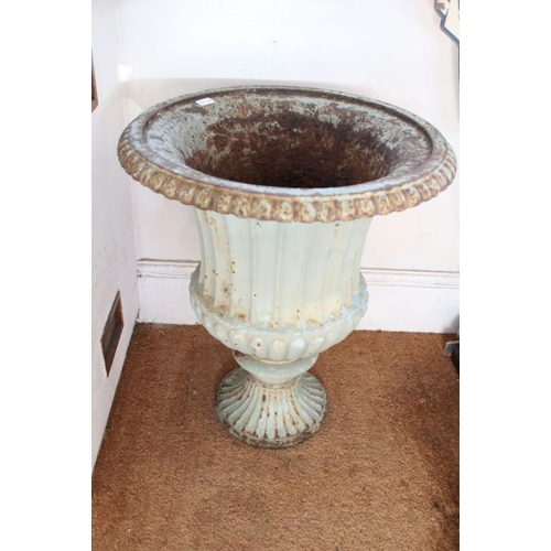 303 - A Regency design cast iron Campana form urn, with egg & dart rim over a fluted waisted body on outsw... 