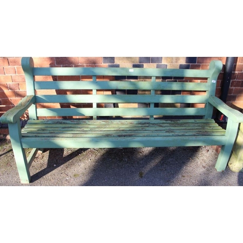 307 - A teak slat built four person garden bench, later painted green. 186 cm wide.