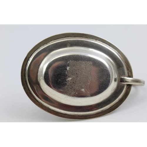 31 - Charles Rawlings, A George IV silver small chamber or taper stick holder, oval base with ring handle... 