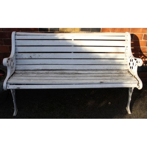 316 - A white painted slatted garden bench with cast metal ends.