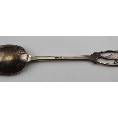 42 - An early 20th century silver spoon the handle terminal pierced and engraved with an image of the Pie... 