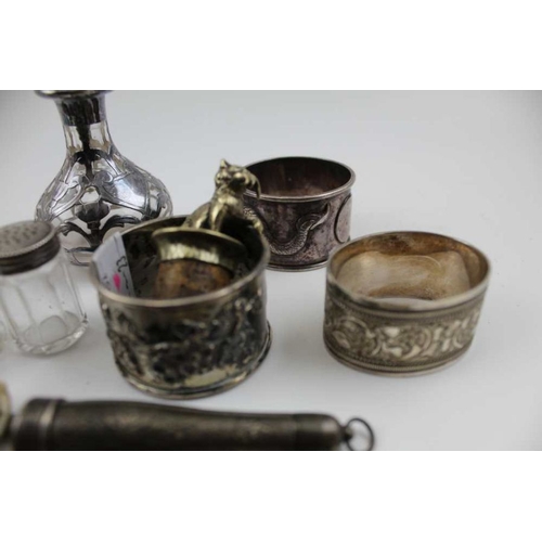 43 - Two Chinese silver napkin rings, one with a dragon in the round, the other, a blossom bough, togethe... 