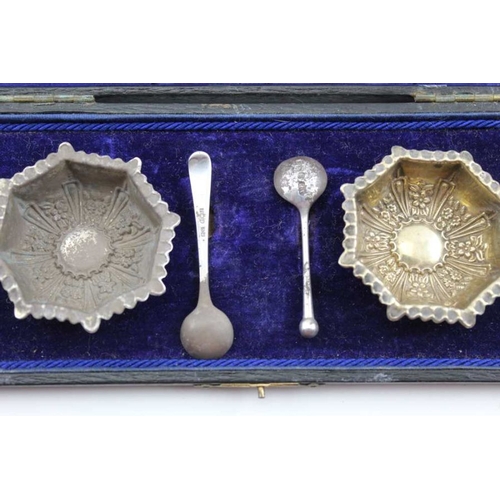 45 - A cased EPNS egg set, comprising cup and spoon, together with a pair of silver salts with two silver... 