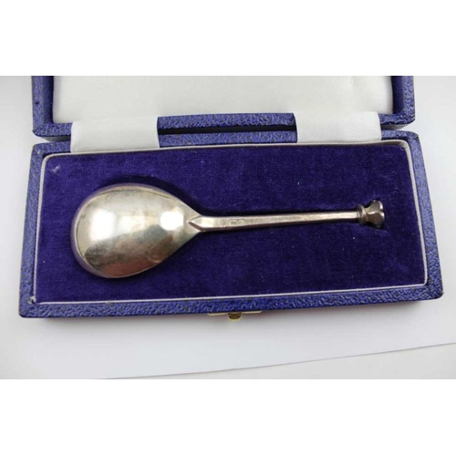 46 - A Georgian design silver tea strainer with turned wood handle, a Georgian silver ladle with twisted ... 