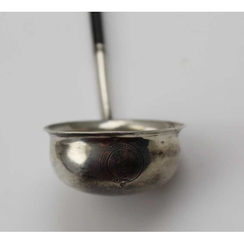 46 - A Georgian design silver tea strainer with turned wood handle, a Georgian silver ladle with twisted ... 