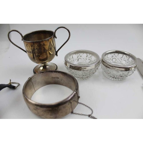 47 - A Victorian design silver bangle, a quantity of costume jewellery and watches, a silver case contain... 