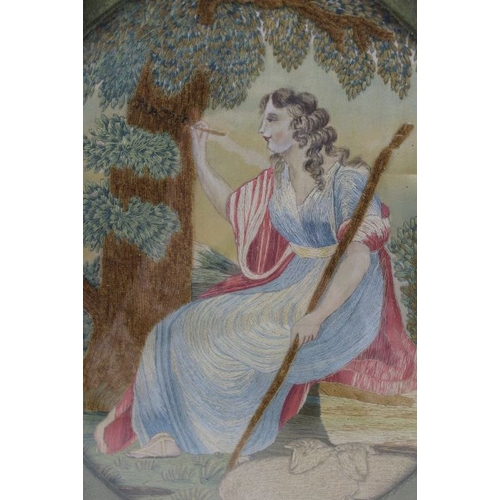 105 - A 19th century silk work picture, depicts a Shepherdess writing on a tree trunk, 29cm x 25cm, oval m... 