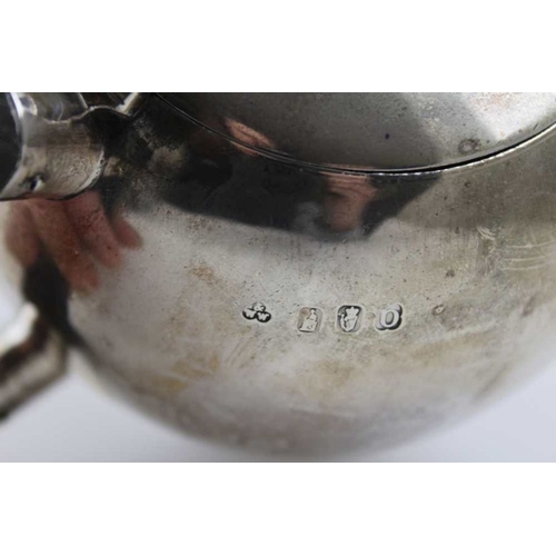 11 - Wakeley & Wheeler, An Irish silver bachelor teapot, of spherical form, on stepped base, Dublin 1917 ... 