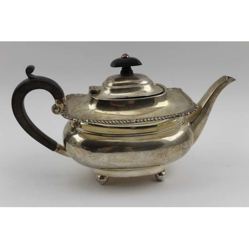 12 - Mappin & Webb, An Edwardian silver bachelor teapot, Georgian design, with gadrooned rim, raised on f... 