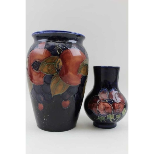 128 - A Moorcroft vase, tube lined and painted finches decoration, factory marks to base, 15cm high, toget... 