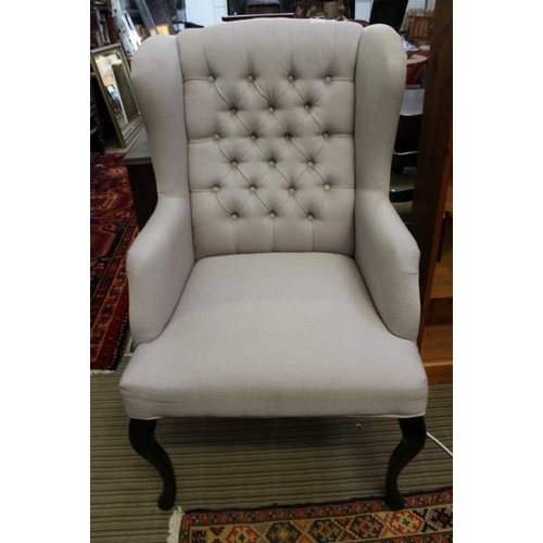 144 - A pair of grey, button backed high back lounge chairs.