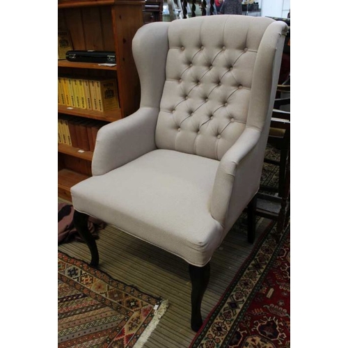 144 - A pair of grey, button backed high back lounge chairs.