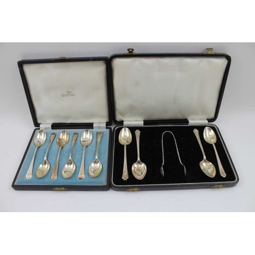 17 - A pair of silver sugar tongs, together with a cased set of six silver coffee spoons, a part set of s... 