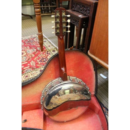 179 - A cased 8 string banjo with chromed body and traditional wooden neck