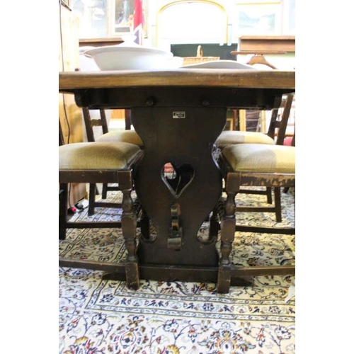 227 - Reproduction oak rectangular topped refectory table, with shaped and pierced plank supports, united ... 