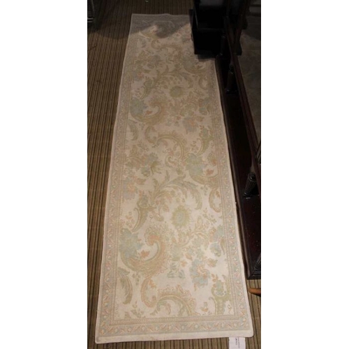 264 - A Laura Ashley floor runner, pale blue ground 63 x 236 cm, together with a three tier coffee table a... 