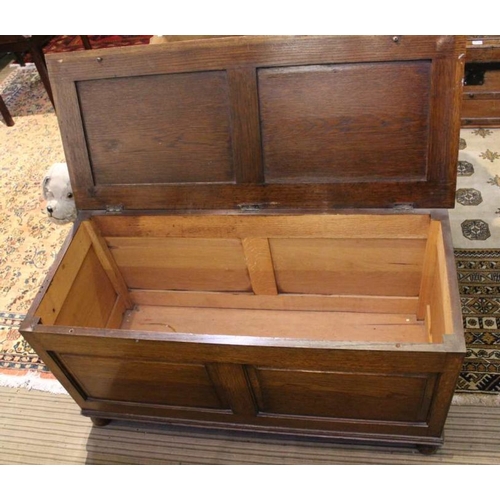 269 - 20th century oak plain panelled box coffer on bun feet, 54 x 105 cm