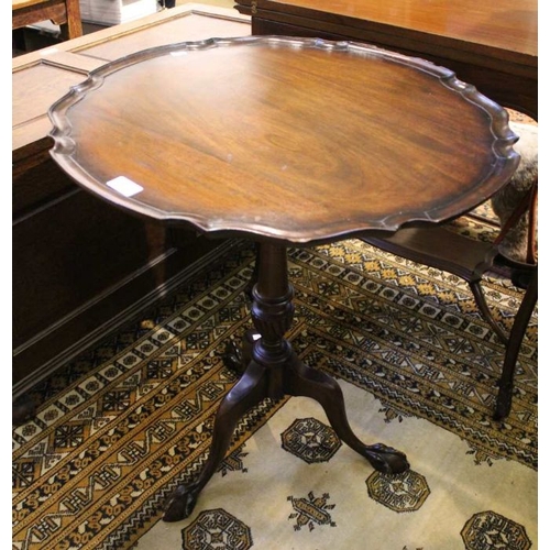 270 - A mahogany snap top, pie crust rim tripod table, 59cm diameter