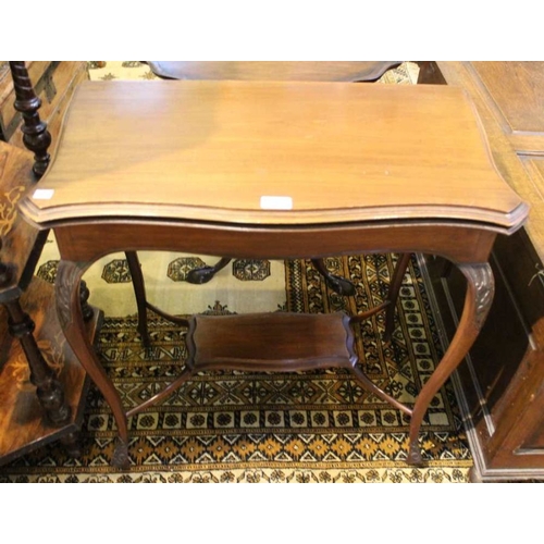 271 - An Edwardian mahogany fold over card table, serpentine front, with undertier, 70cm wide