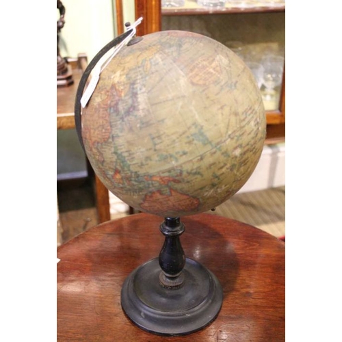 290 - An early 20th century 8 inch terrestrial globe by Geographica Ltd of London on turned wooden baluste... 