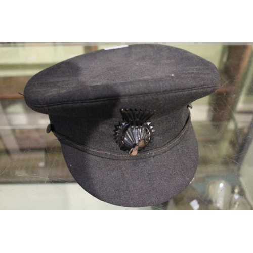 295 - J.W. Taylor and son - a military peaked cap with badge