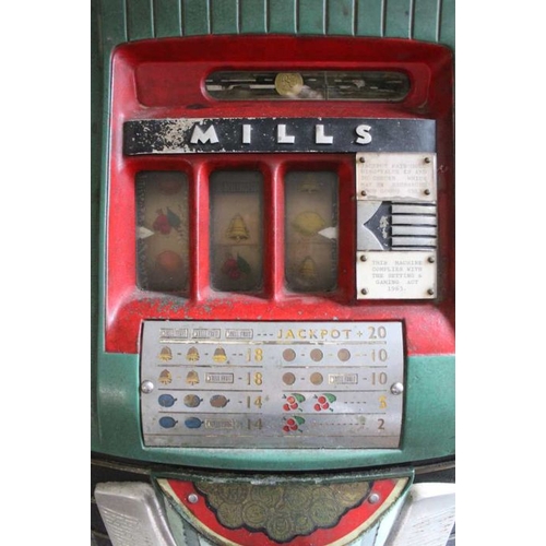 331 - A late 1960's cast metal Mills branded token operated Fruit Machine, standing 68cm high, on a 46cm w... 