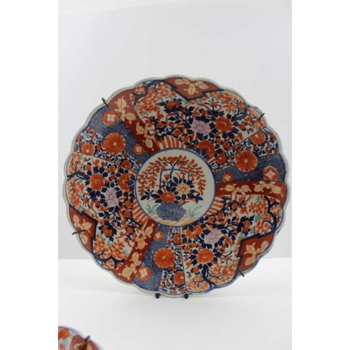 42 - A Japanese Imari porcelain charger, painted and gilded with vase of flowers decoration, 37cm in diam... 