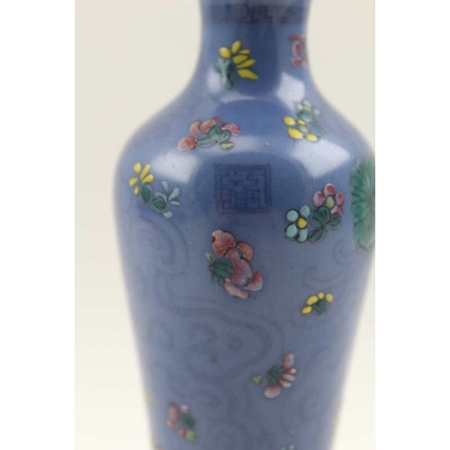 46 - A Chinese porcelain vase of slender tapering form, blue glaze enamelled flowers in colours pink, yel... 