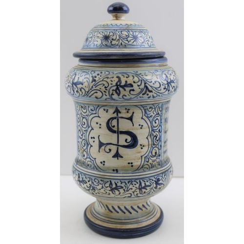 58 - A Deruta majolica dry drug jar, blue painted with putti decoration, inscribed (Mentueria), 30cm high